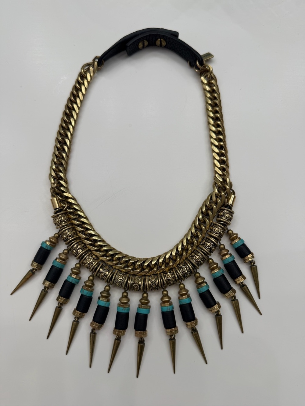Jenny Bird Gold and turquoise collar necklace with leather detail.